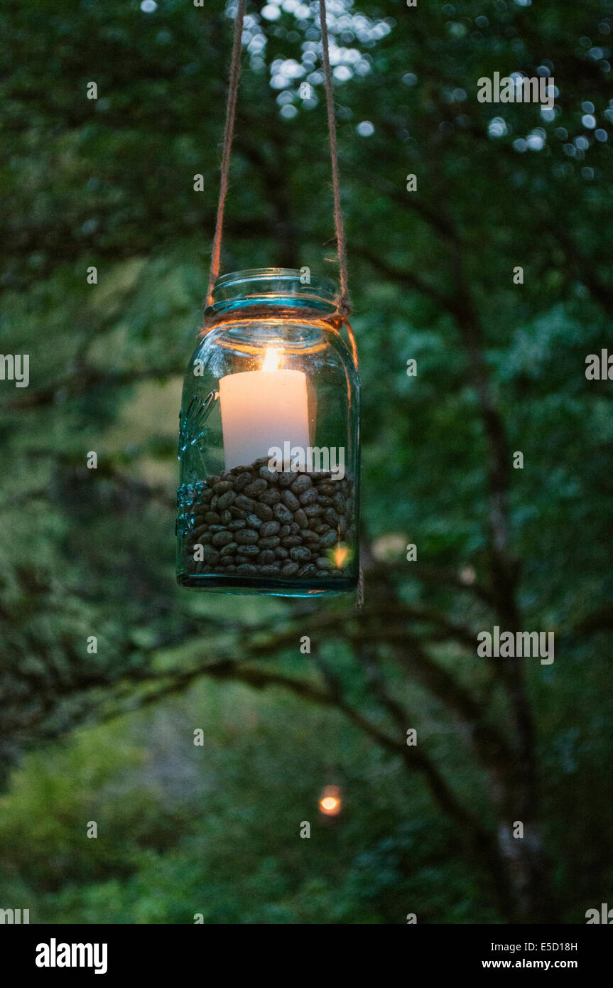 A candle lantern hanging on a tree Stock Photo