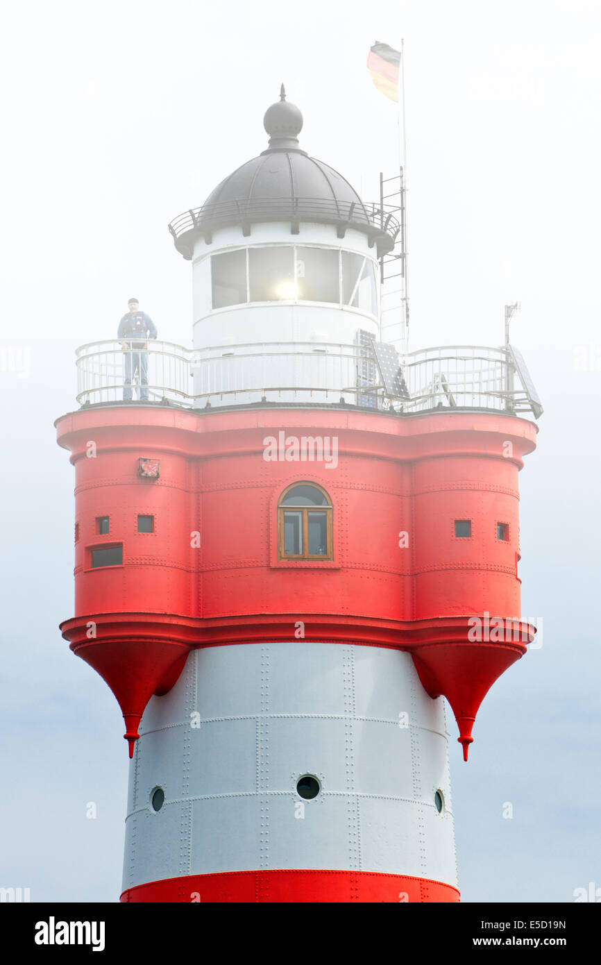 Lighthouse keeper on Roter Sand lighthouse in the fog Stock Photo