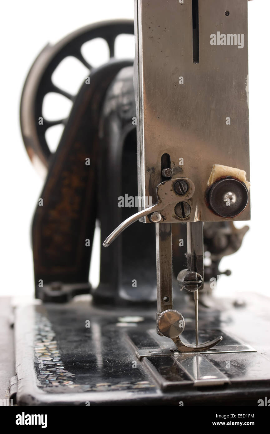 Old sewing machine isolated on a white background Stock Photo - Alamy