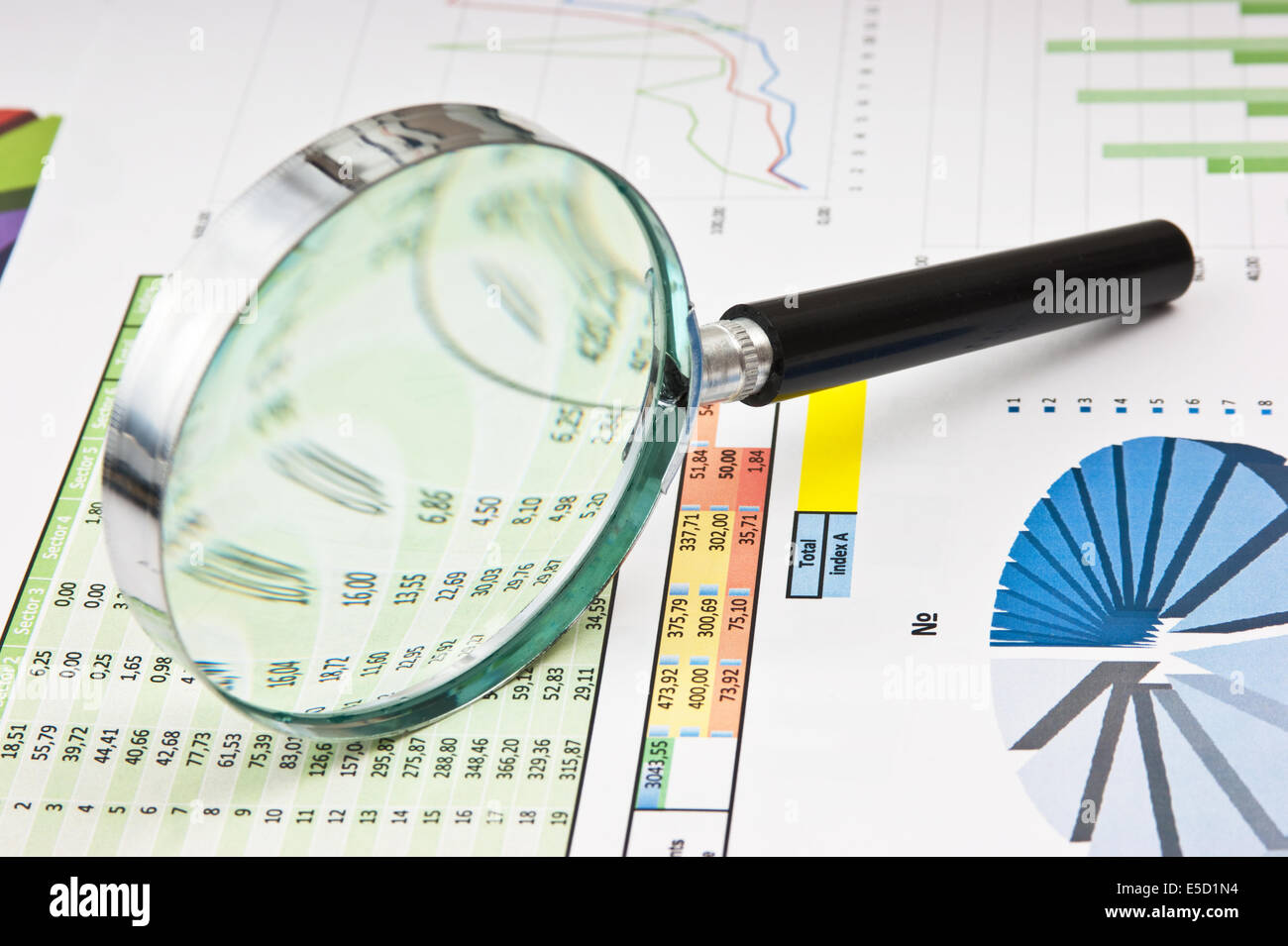 magnifying glass and the working paper with a diagram Stock Photo - Alamy