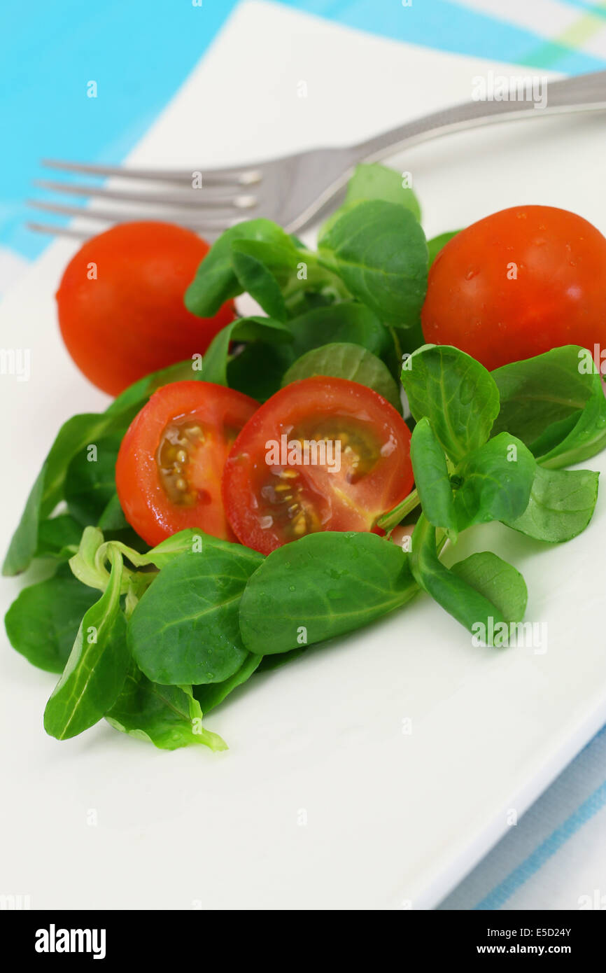 Corn salad with cherry tomatoes, close up Stock Photo