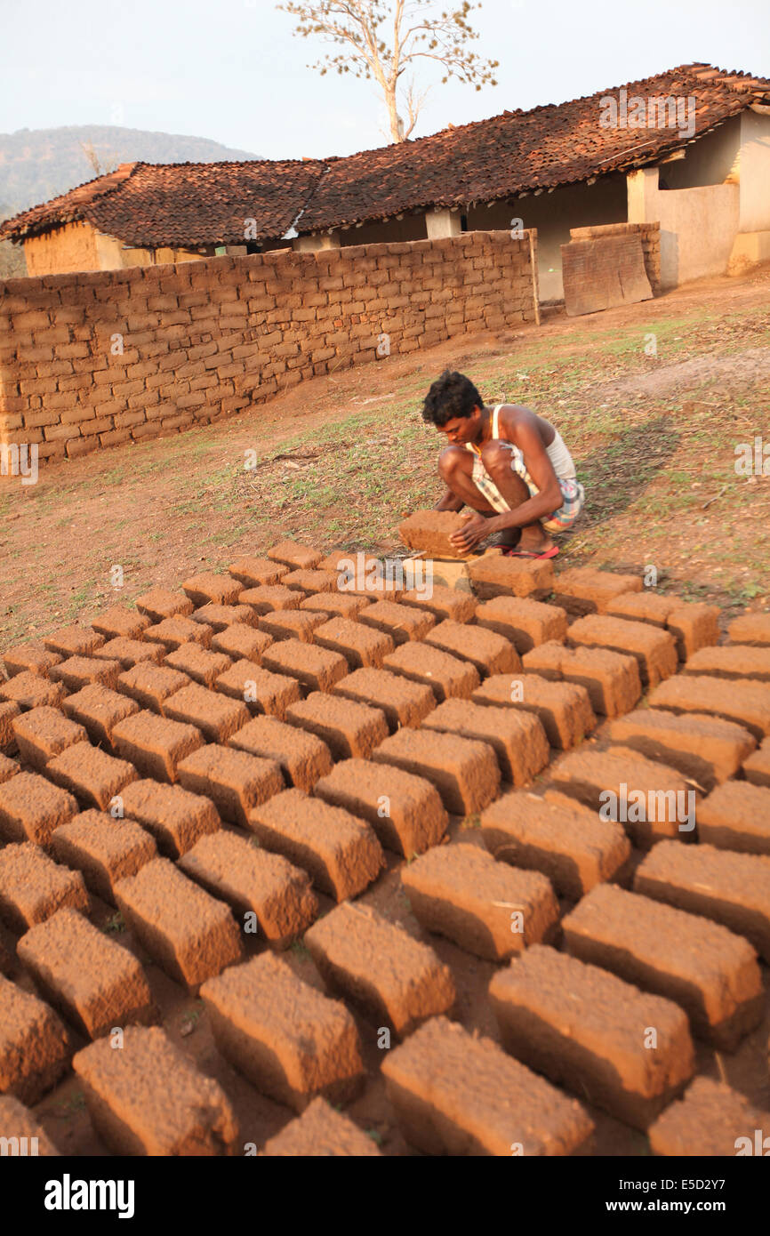 Man making bricks and keeping them to dry out, Chattisgadh, India Stock Photo