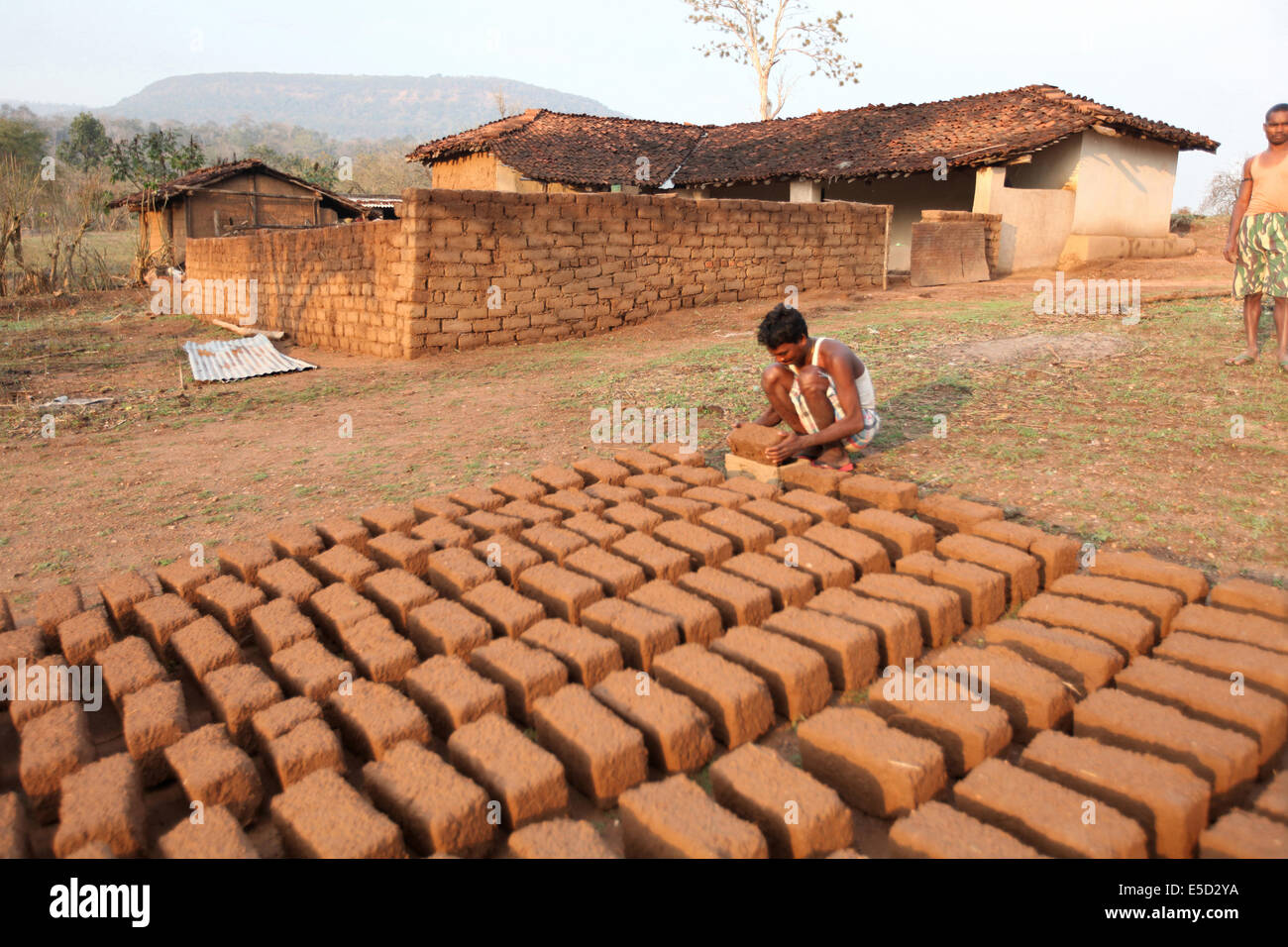 Man making bricks and keeping them to dry out, Chattisgadh, India Stock Photo
