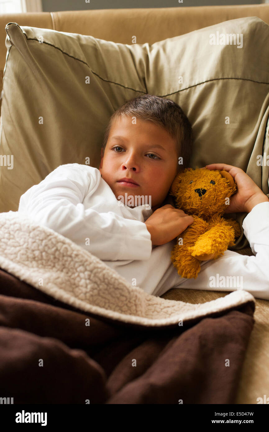 Child Feeling Sick In Bed Stock Photo - Alamy
