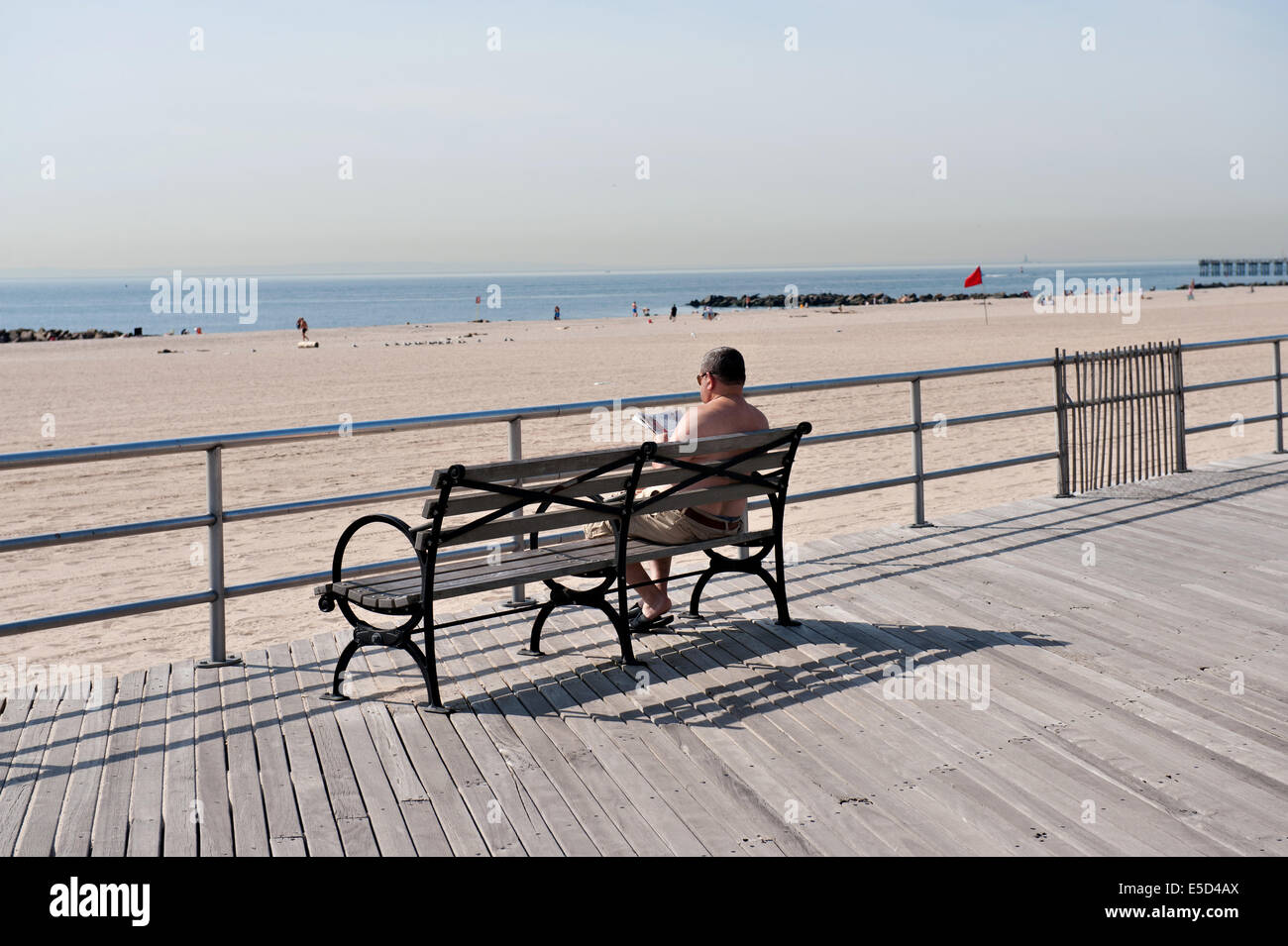 Man on bench Stock Photo