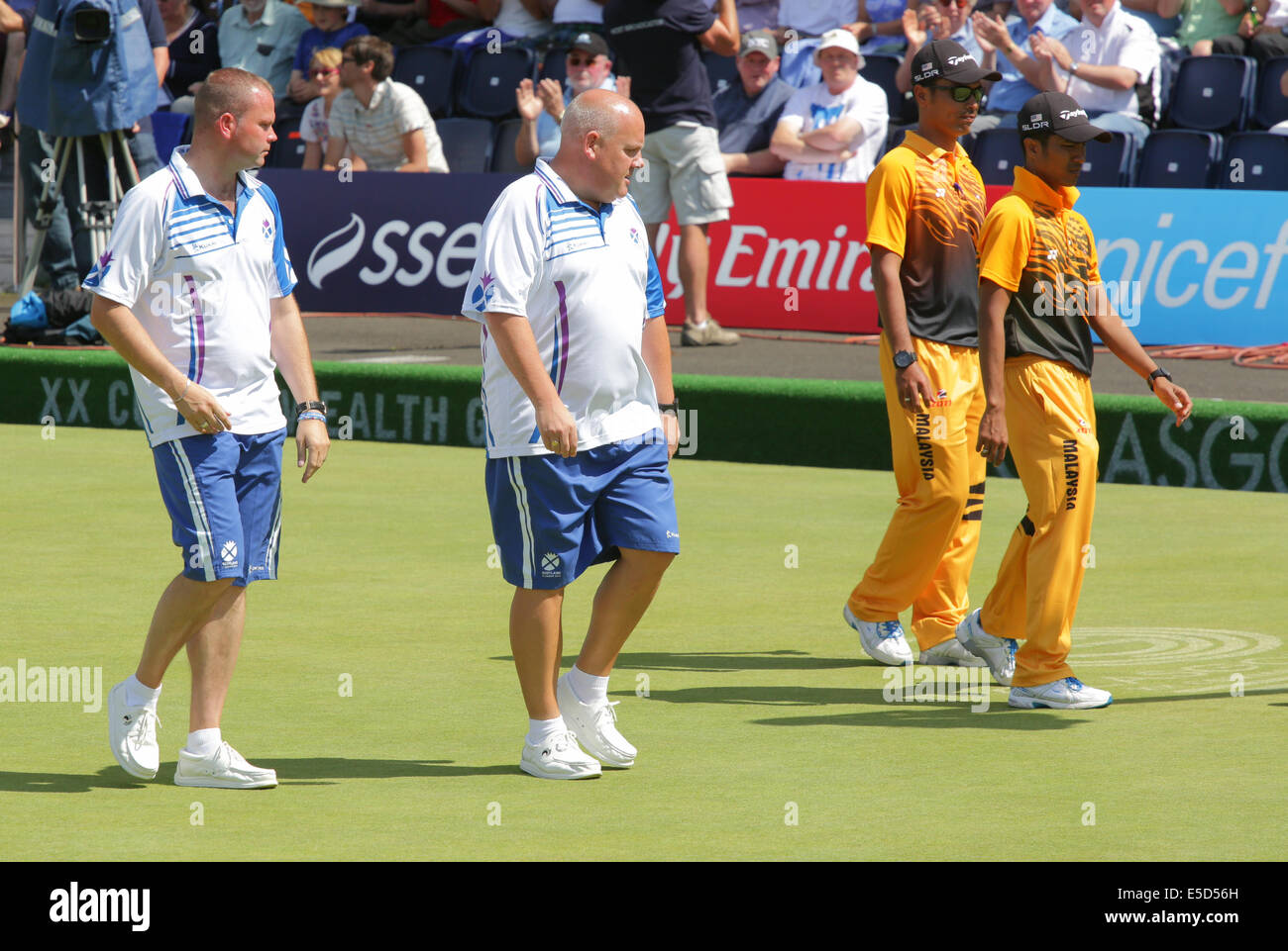 Kelvingrove Lawn Bowls Centre, Glasgow, Scotland, UK, Monday, 28th July, 2014. The Men's Lawn Bowls Pairs Final between Scotland's Paul Foster and Alex Marshall and Malaysia's Muhammad Hizlee Abdul Rais and Fairul Izwan Abd Muin at the Glasgow 2014 Commonwealth Games Stock Photo