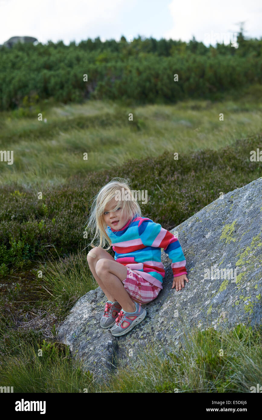 Child blond girl tourist exploring the Giant mountains, Krkonose, Czech Republic Stock Photo
