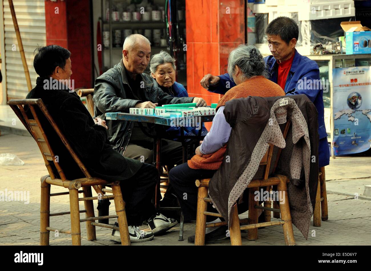 JIU CHI TOWN (SICHUAN), CHINA: A group of Chinese people playing ...