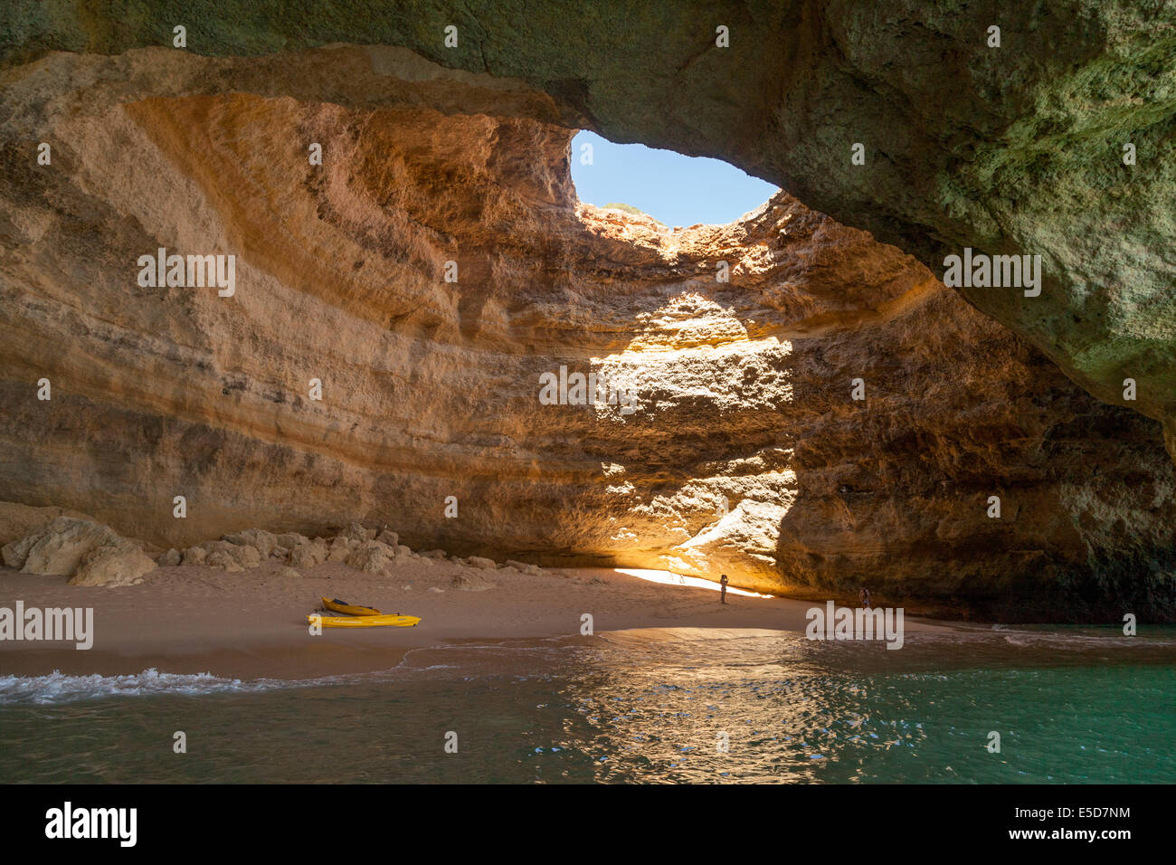 The interior of the 'Cathedral' sea cave with a secret beach accessible only by sea, Algarve coast near Benagil, Portugal Europe Stock Photo