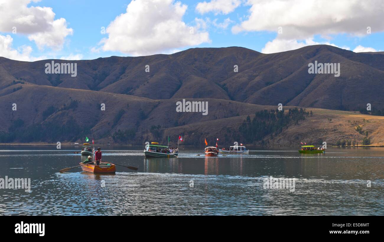 Boats full of tourists sail on the Laguna de Paca, near Huancayo, Peru Stock Photo