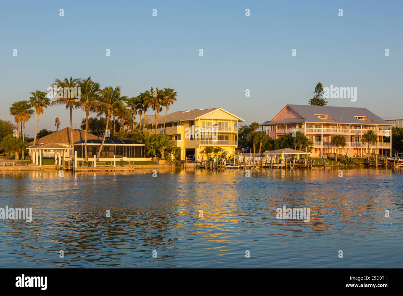 Houses in sunset light on Gulf Intercoastal Waterway in Nokomis Florida Stock Photo