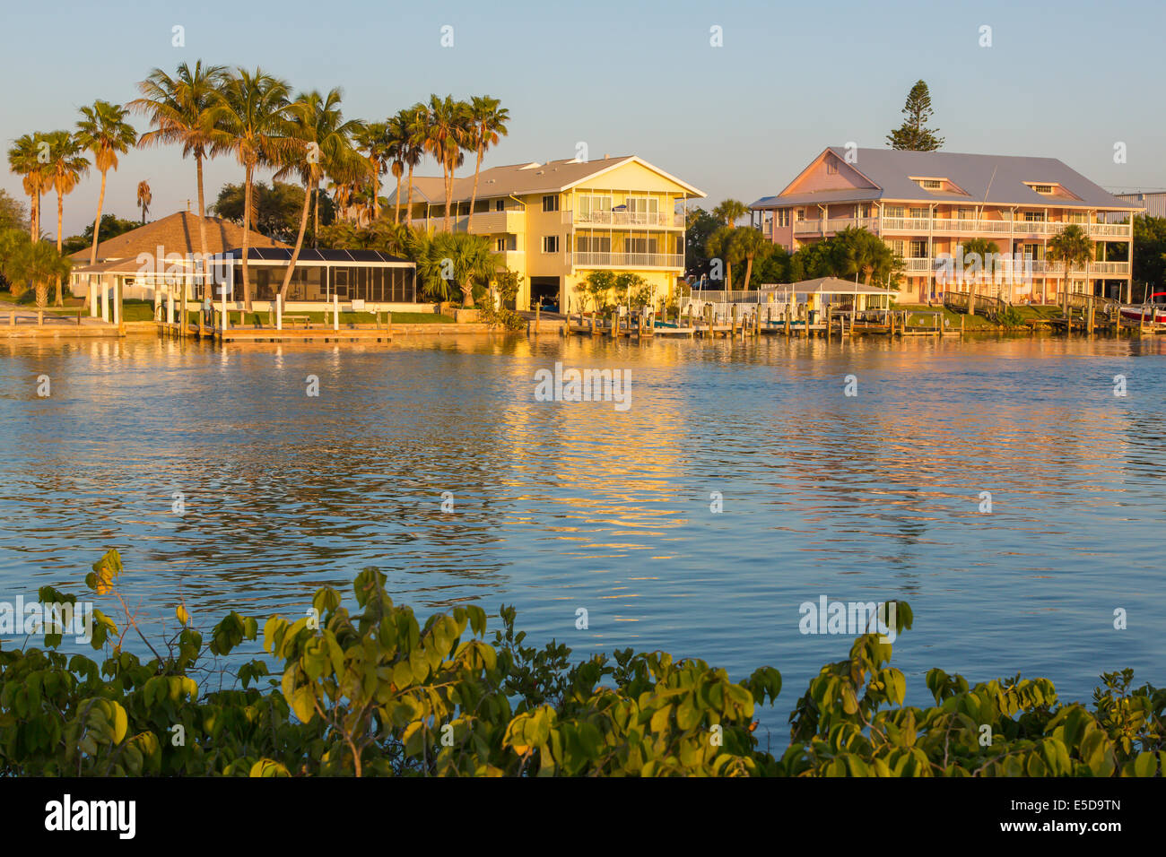Houses in sunset light on Gulf Intercoastal Waterway in Nokomis Florida Stock Photo