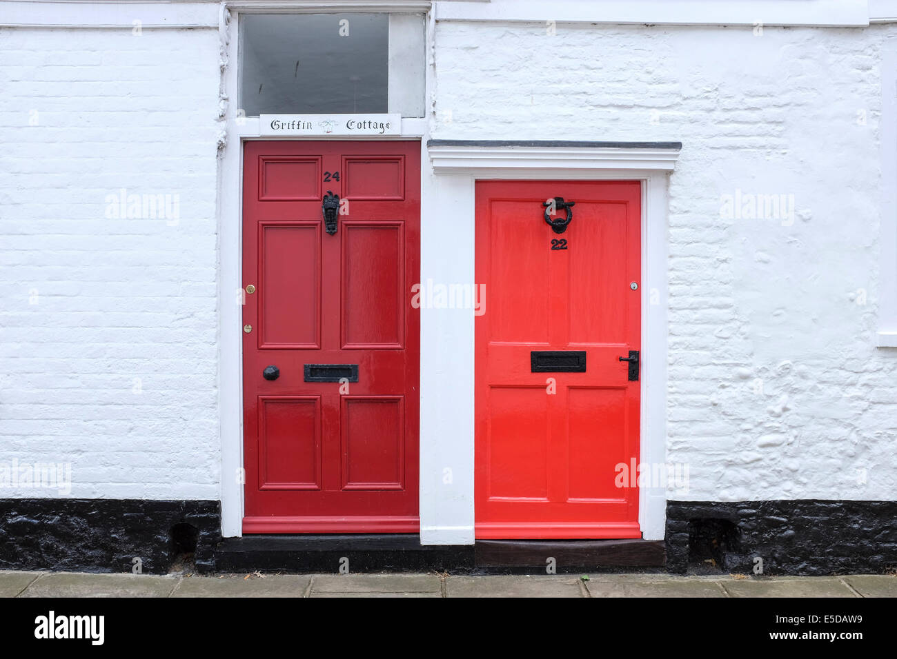 Couple of red doors in the small village of Sandwich, UK Stock Photo