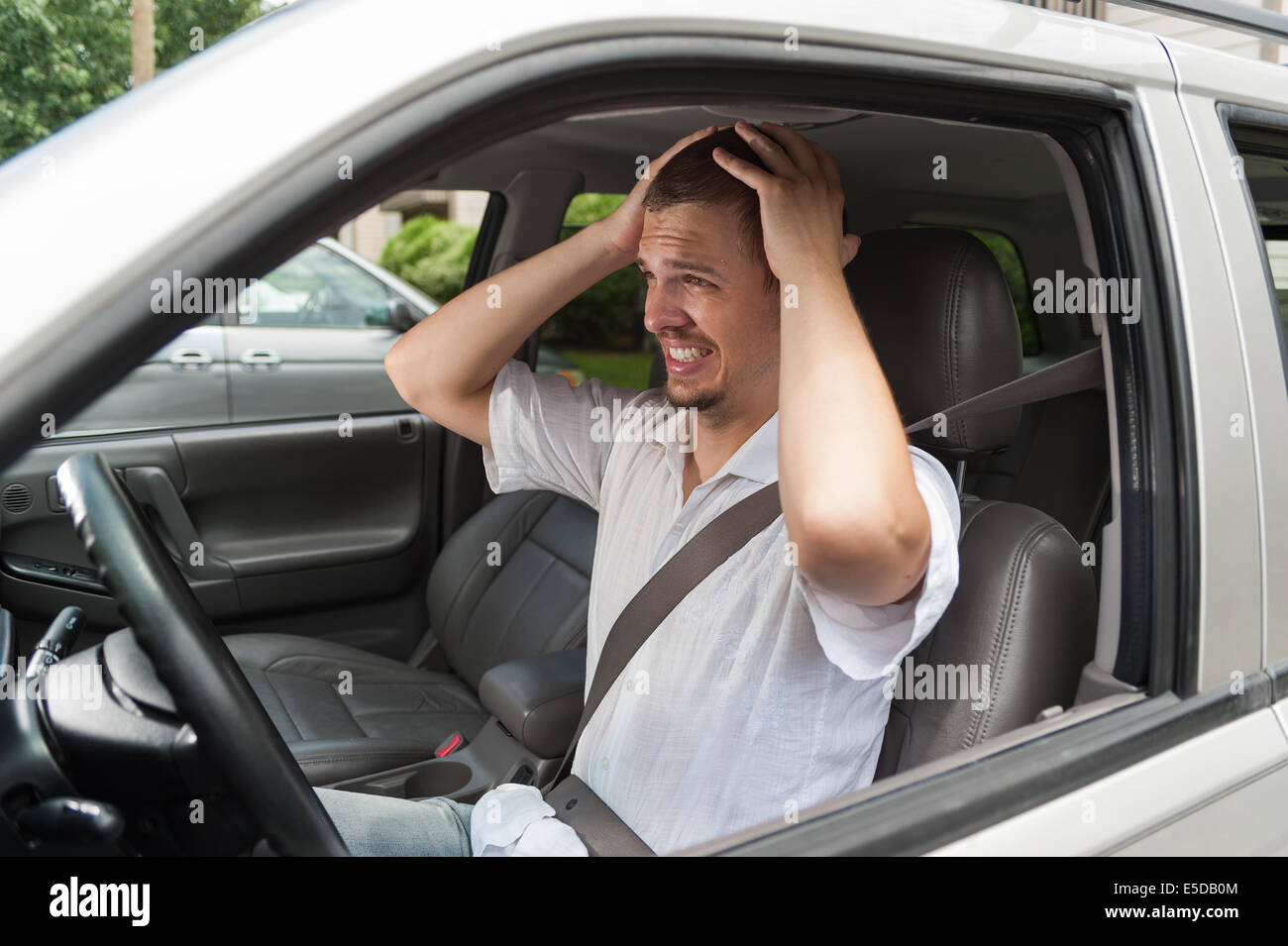 Young caucasian driver did something wrong Stock Photo