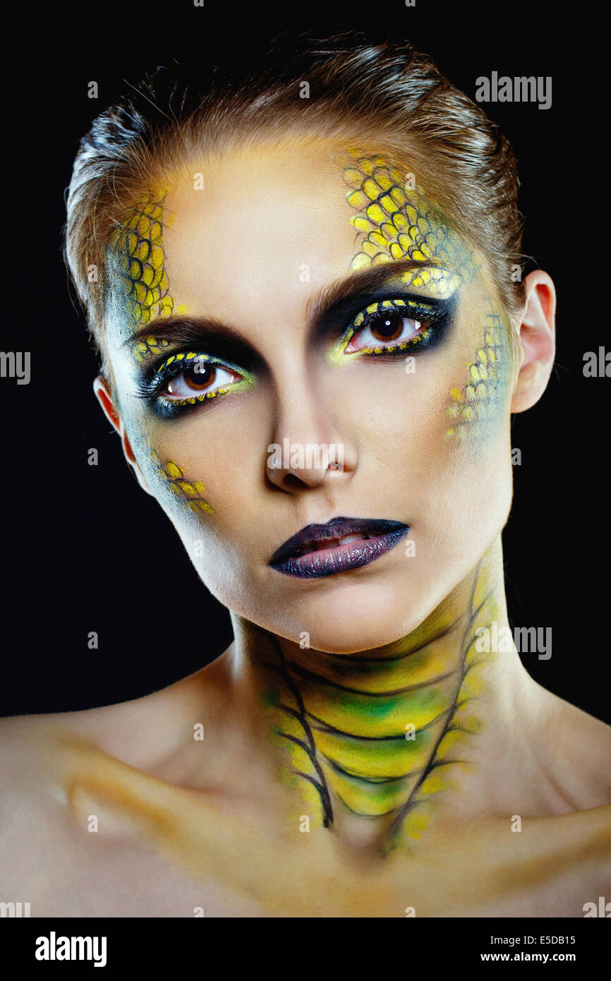 Attractive young woman in makeup snake shot in the studio Stock Photo -  Alamy
