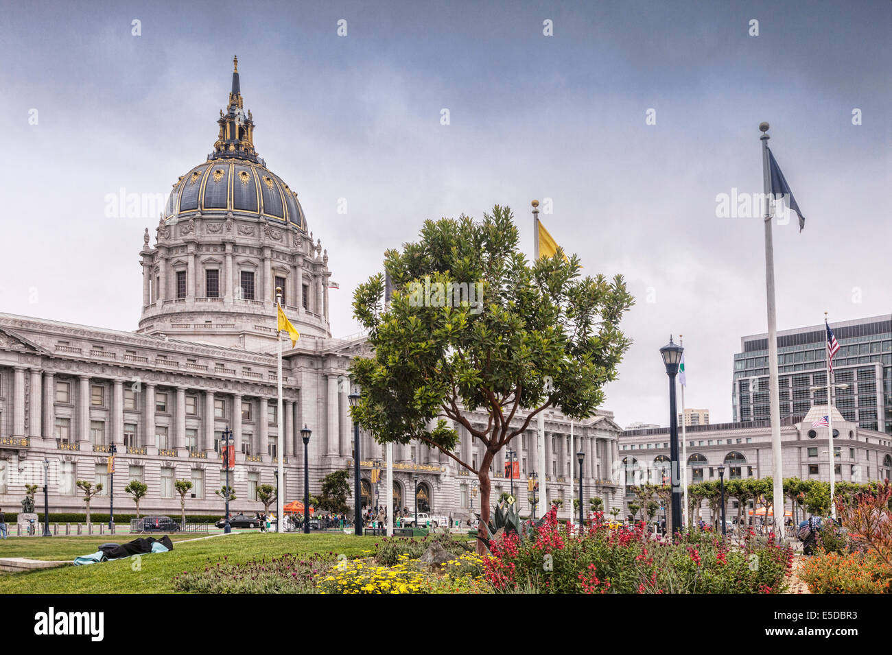 San Francisco City Hall, on a soft light day in Spring. A homeless person can be seen sleeping rough. Stock Photo