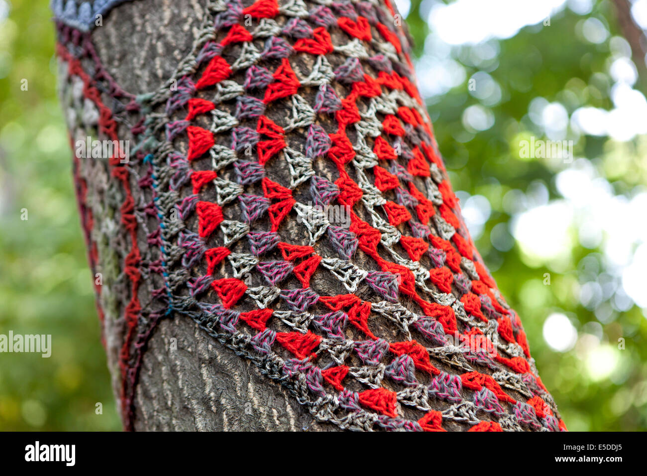 Knitting tree trunk, crochet tree in the garden bar 'U vystřelenýho oka' Zizkov Prague Czech Republic Stock Photo
