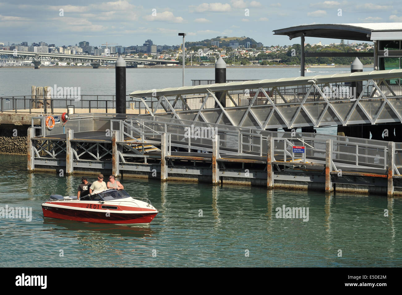 Boat with three members crew coming back to shore near Birkenhead wharf