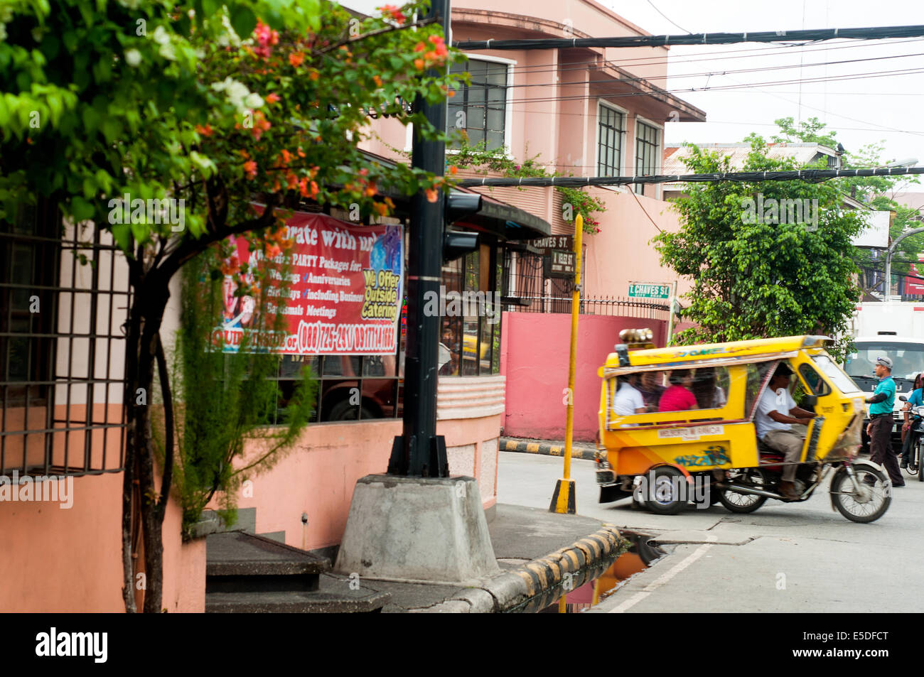 Street scene with tricycles, CBD, Cagayan de Oro, Misamis Oriental, Mindanao, Philippines Stock Photo