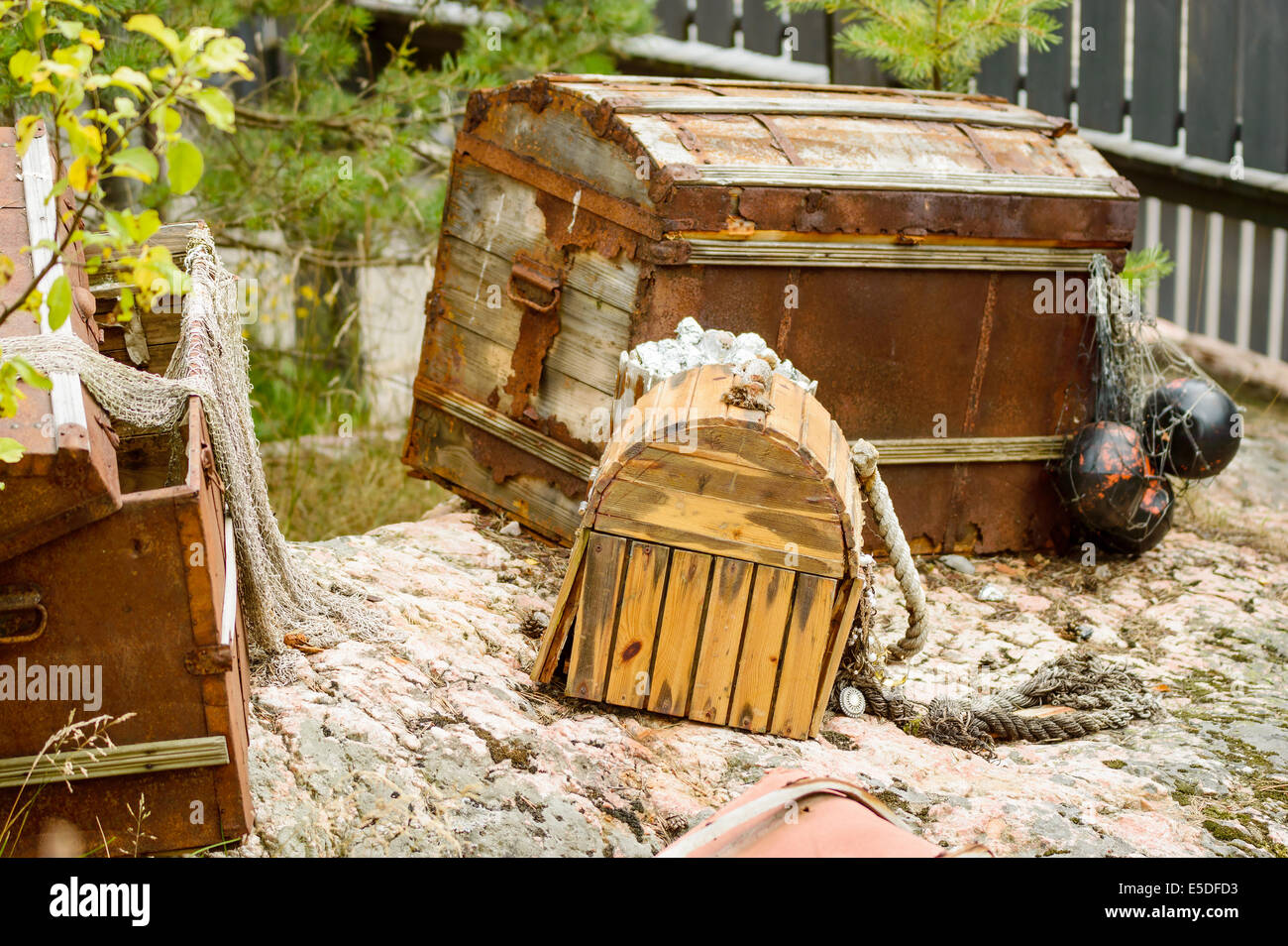 Open treasure trunk or chest with debris and junk from the sea Stock