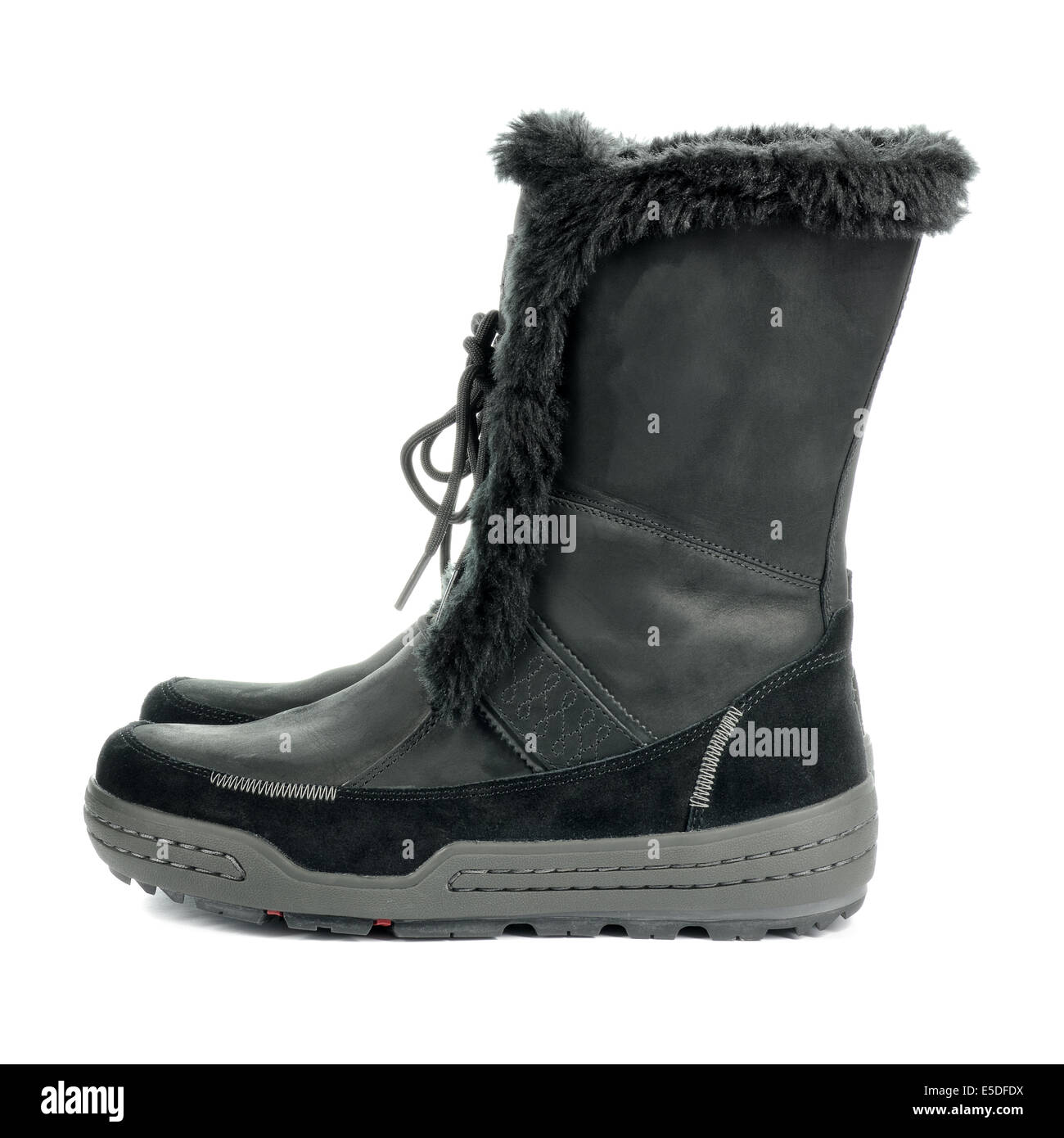 Black warm feminine boots. Winter shoes isolated on white background. Stock Photo