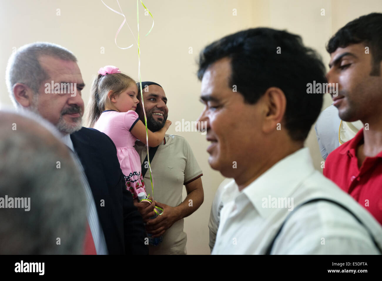 Kiev, Ukraine. 28th July, 2014. Eid-al-Fitr in Kiev. Eid-al-Fitr is feast, that marks the end of Holy month Ramadan. This year refugees from Crimea and Syria celebrate Eid-al-Fitr in Kiev. Mustafa Dzhemilev, ex-chairman of Crimean Mejlis and persona non-grata in Crimea, also visited mosque. Credit:  Oleksandr Rupeta/Alamy Live News Stock Photo