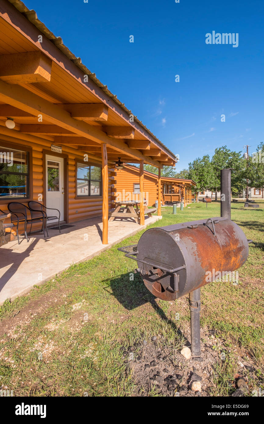 Usa Texas Log Homes With Bbq Smoker In Front Stock Photo
