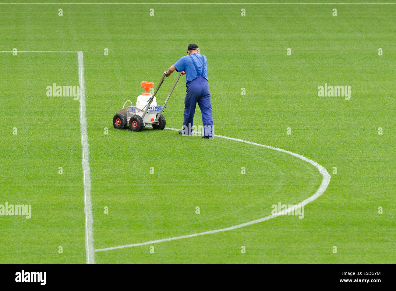 A man painting line on a football stadium Stock Photo Alamy