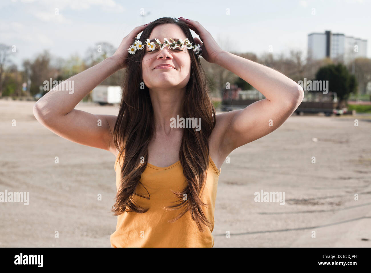 Young woman with flower wreath in her hair Stock Photo - Alamy