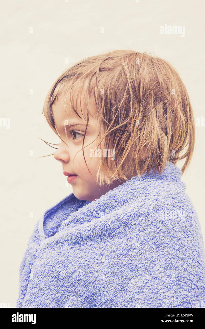 Profile of little girl with wet hair wrapped in a towel Stock Photo Alamy