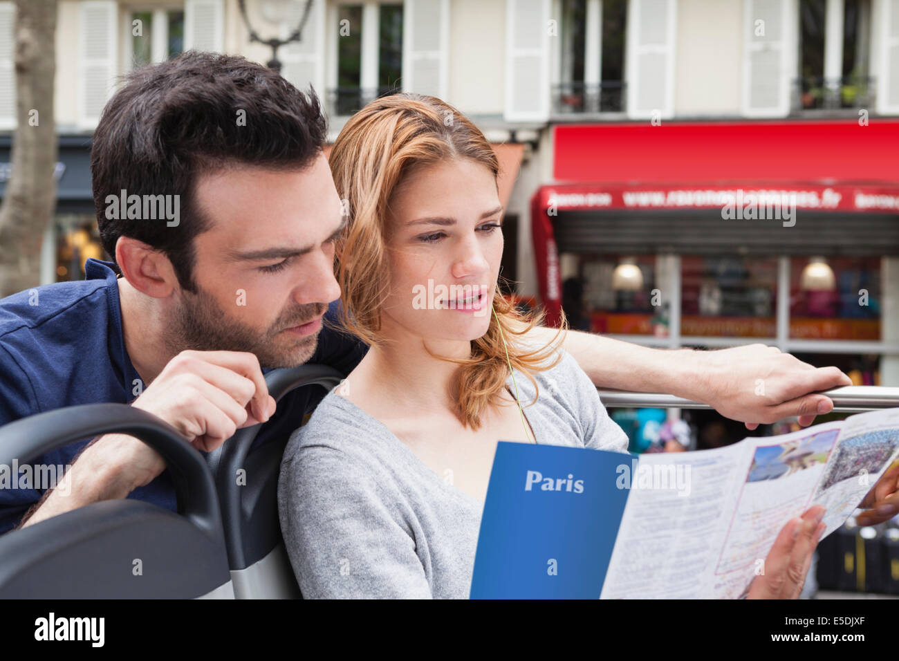 France, Paris, couple looking at a city map Stock Photo