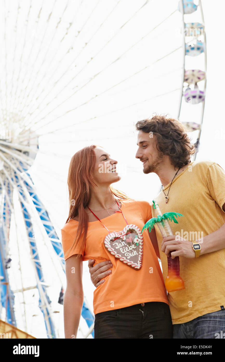 Happy young couple on a funfair Stock Photo