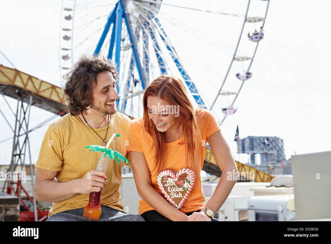 Happy young couple on a funfair Stock Photo