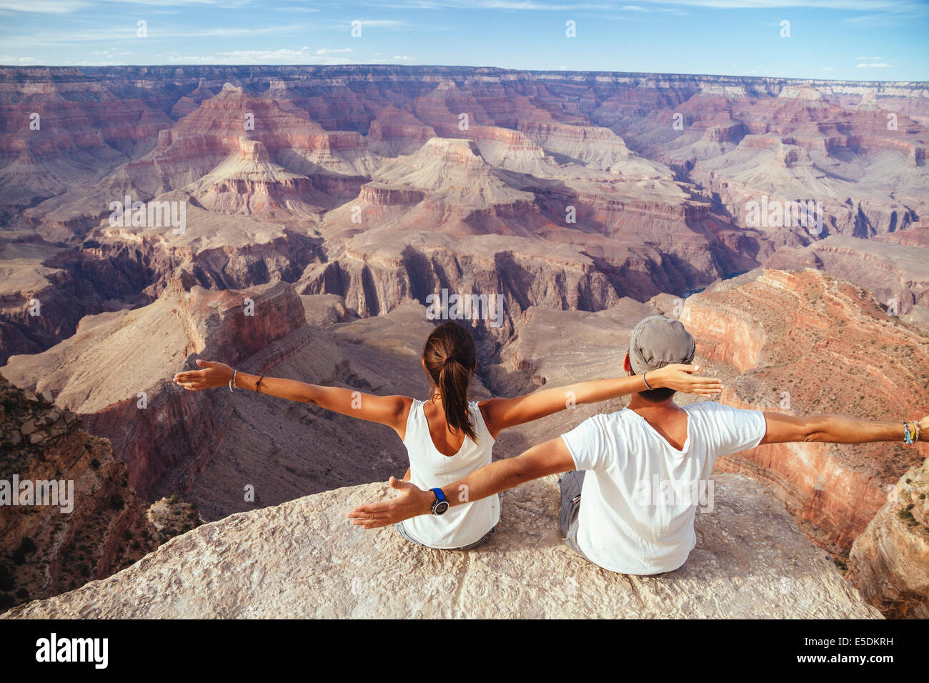 USA, Arizona, couple enjoying the view at Grand Canyon, back view Stock Photo