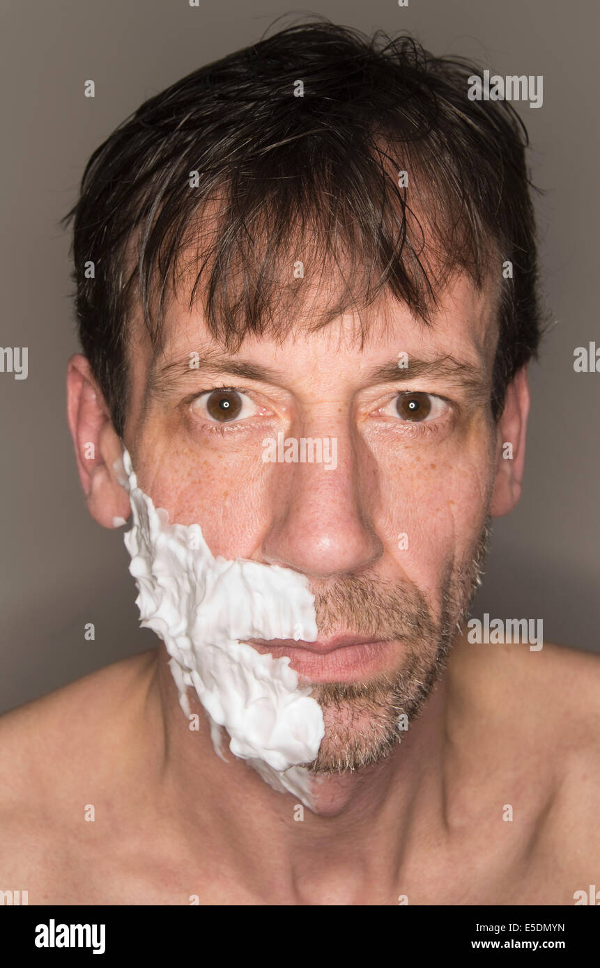 Portrait of half-shaved man Stock Photo