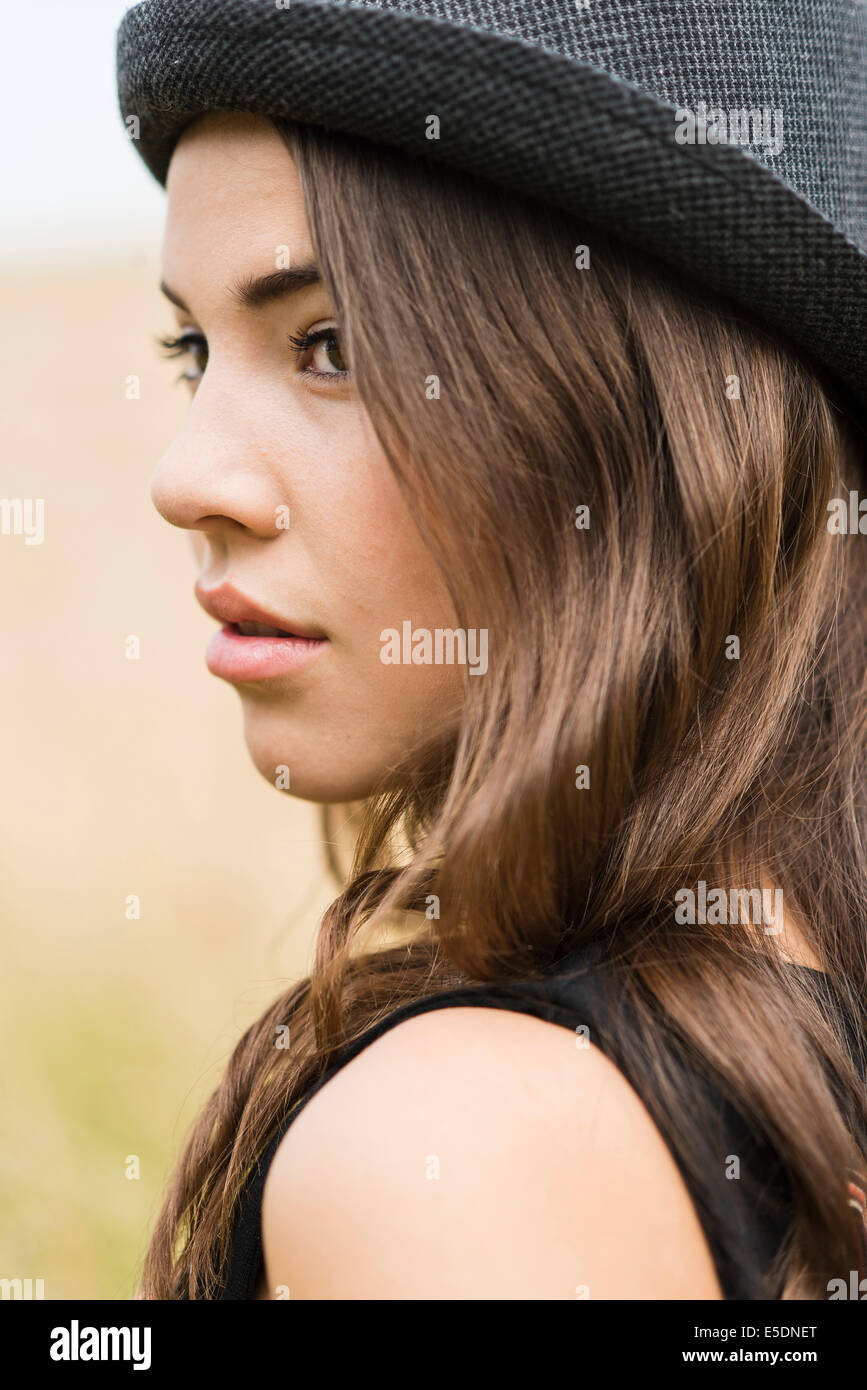 Person wearing black hat hi-res stock photography and images - Alamy