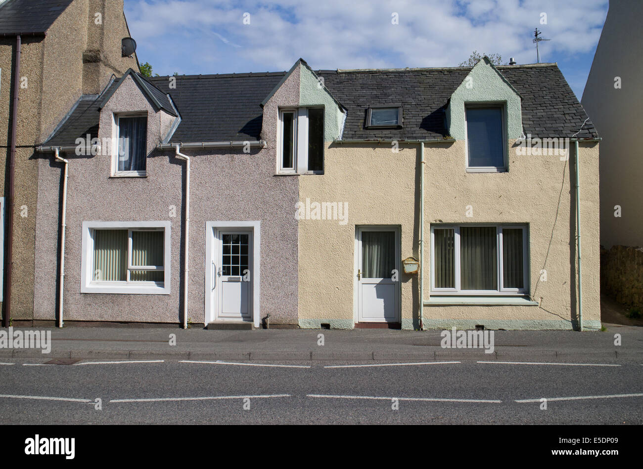 Terraced houses painted cream, Stornoway, Outer Hebrides Stock Photo