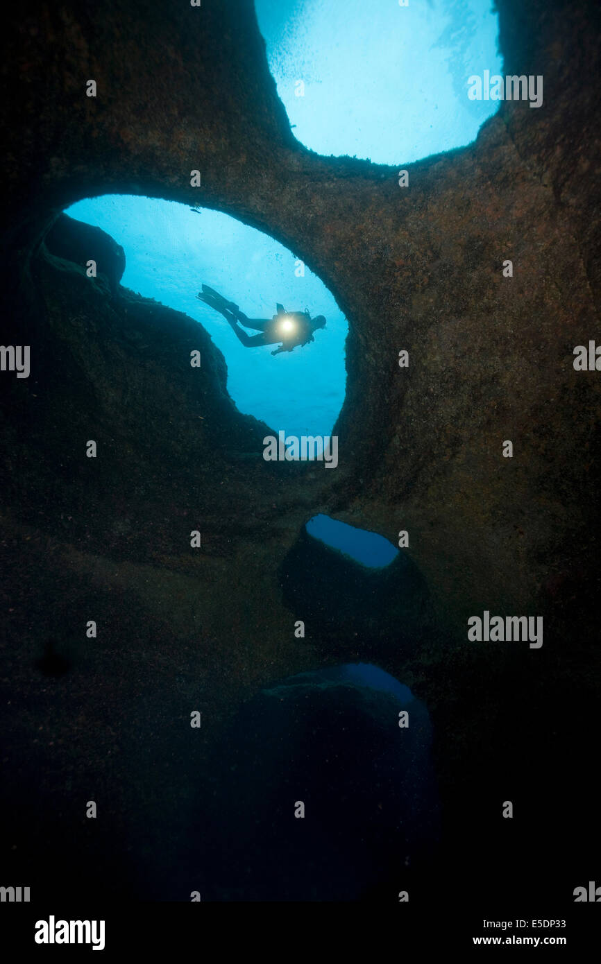 Portugal, Azores, Santa Maria, Atlantic Ocean, diver at volcanic reef ...