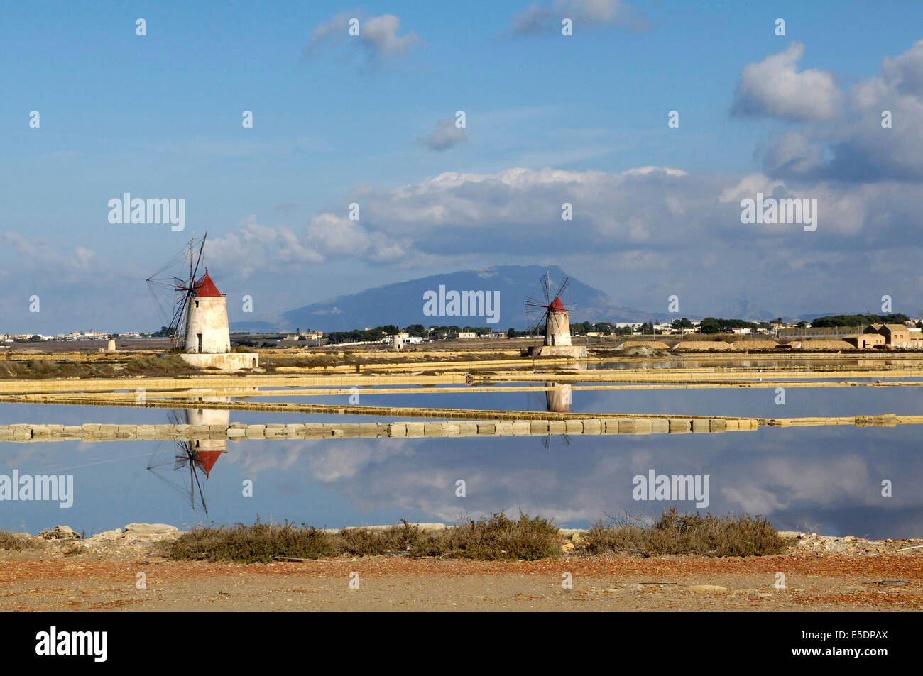 view of the salt pans of Trapani, with a nice background image of Mount Erice Stock Photo
