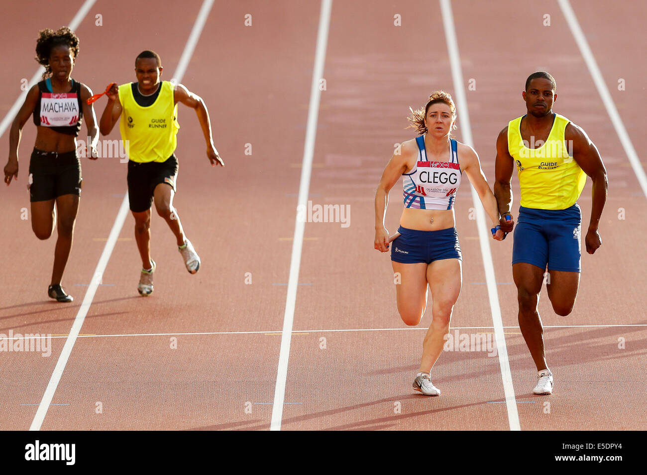 Glasgow, Scotland. 28th July, 2014. Glasgow 2014 Commonwealth Games Day 5. Athletics, Track and Field. Libby Clegg of England wins the Womens T11/12 100m Final with her Guide Runner in tow. © Action Plus Sports/Alamy Live News Stock Photo