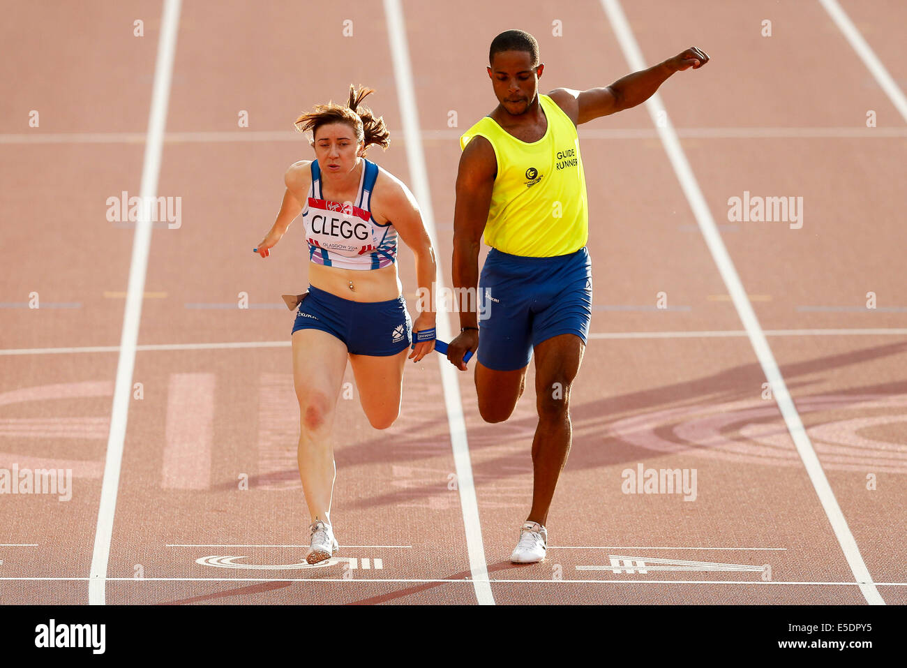 Glasgow, Scotland. 28th July, 2014. Glasgow 2014 Commonwealth Games Day 5. Athletics, Track and Field. Libby Clegg of England wins the Womens T11/12 100m Final with her Guide Runner in tow. © Action Plus Sports/Alamy Live News Stock Photo