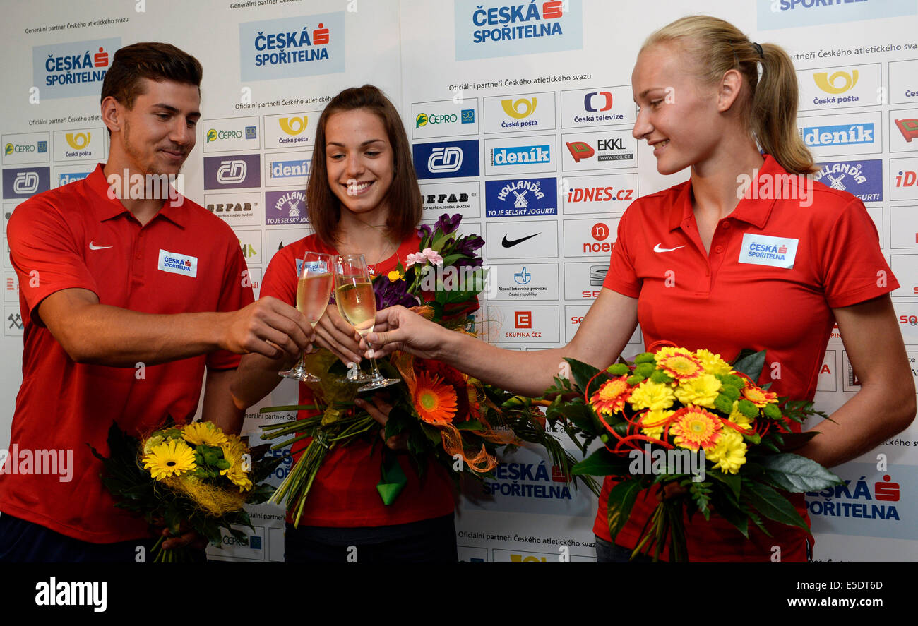 From left: Czech decathlonist Jiri Sykora, winner of the decathlon at the IAAF world junior championships in Eugene, walker Anezka Drahotova and high jumper Michaela Hruba meet journalists after their arrival from the IAAF world junior championships, Prague, Czech Republic, July 29, 2014. (CTK Photo/Michal Krumphanzl) Stock Photo