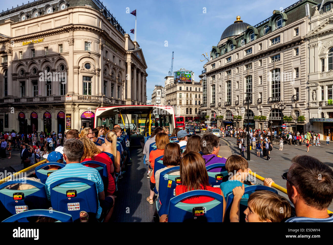 A London Tour Bus Passes By Piccadilly Circus, London, England Stock