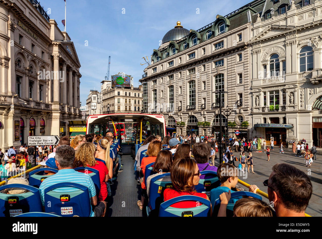 A London Tour Bus Passes By Piccadilly Circus, London, England Stock Photo