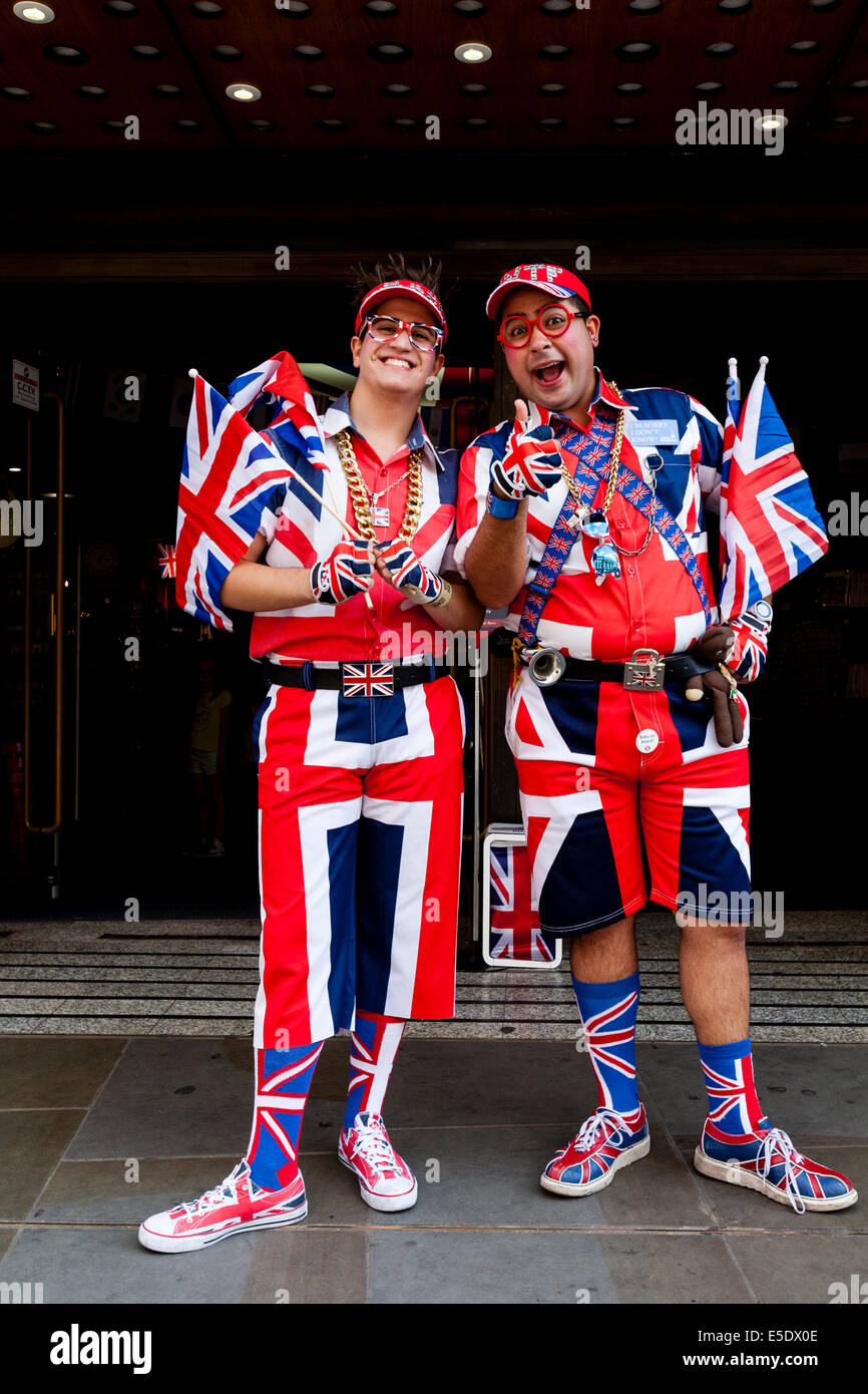 Two Men In Union Jack Costumes Standing Outside The Cool Britannia