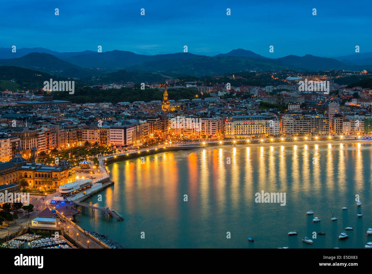 City skyline by night with Bahia de la Concha, Donostia San Sebastian, Gipuzkoa, Basque Country, Spain Stock Photo