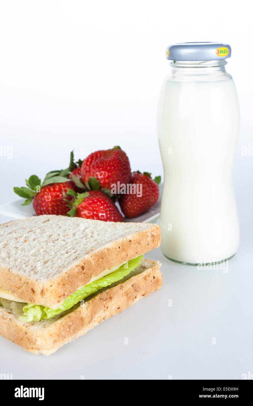 Healthy breakfast, sandwich with lettuce, and cheese, bottle of milk Stock Photo