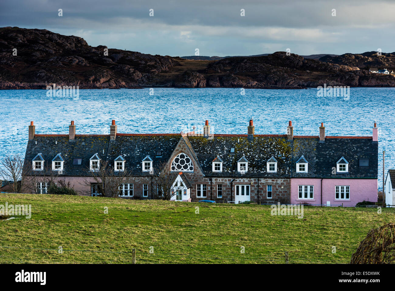 A colourful row of houses on the waterfront on the Isle of Iona Stock