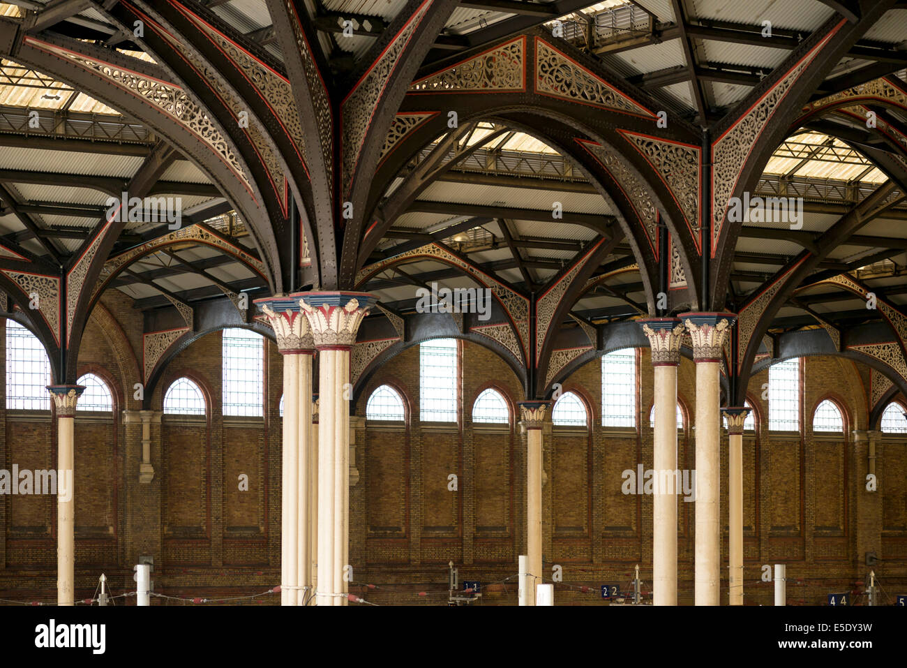 Pillars and decorative wrought iron Victorian arches 