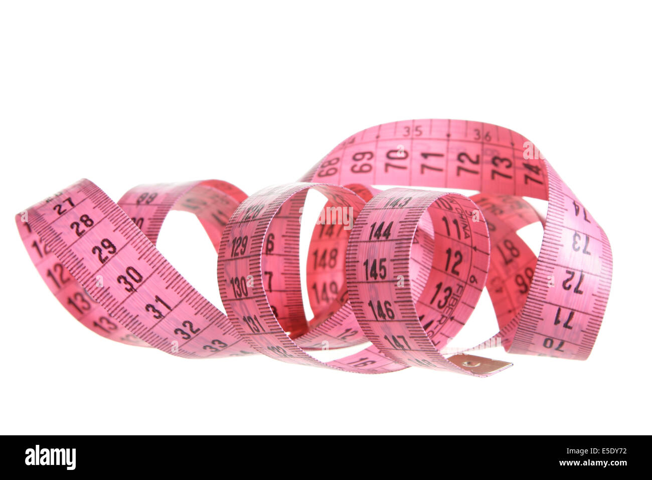 Pink measuring tape isolated over white background Stock Photo - Alamy